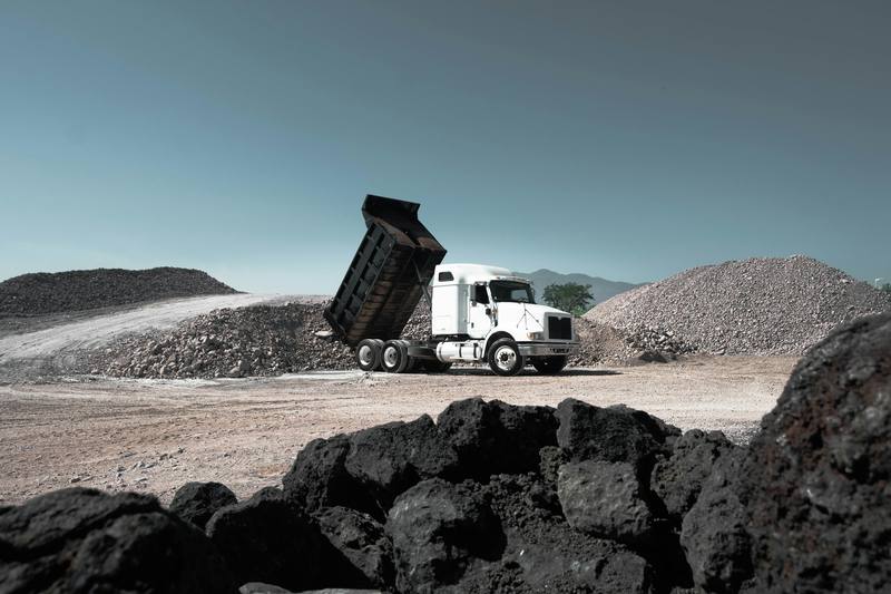 Haul truck tipping ore at a mine stockpile